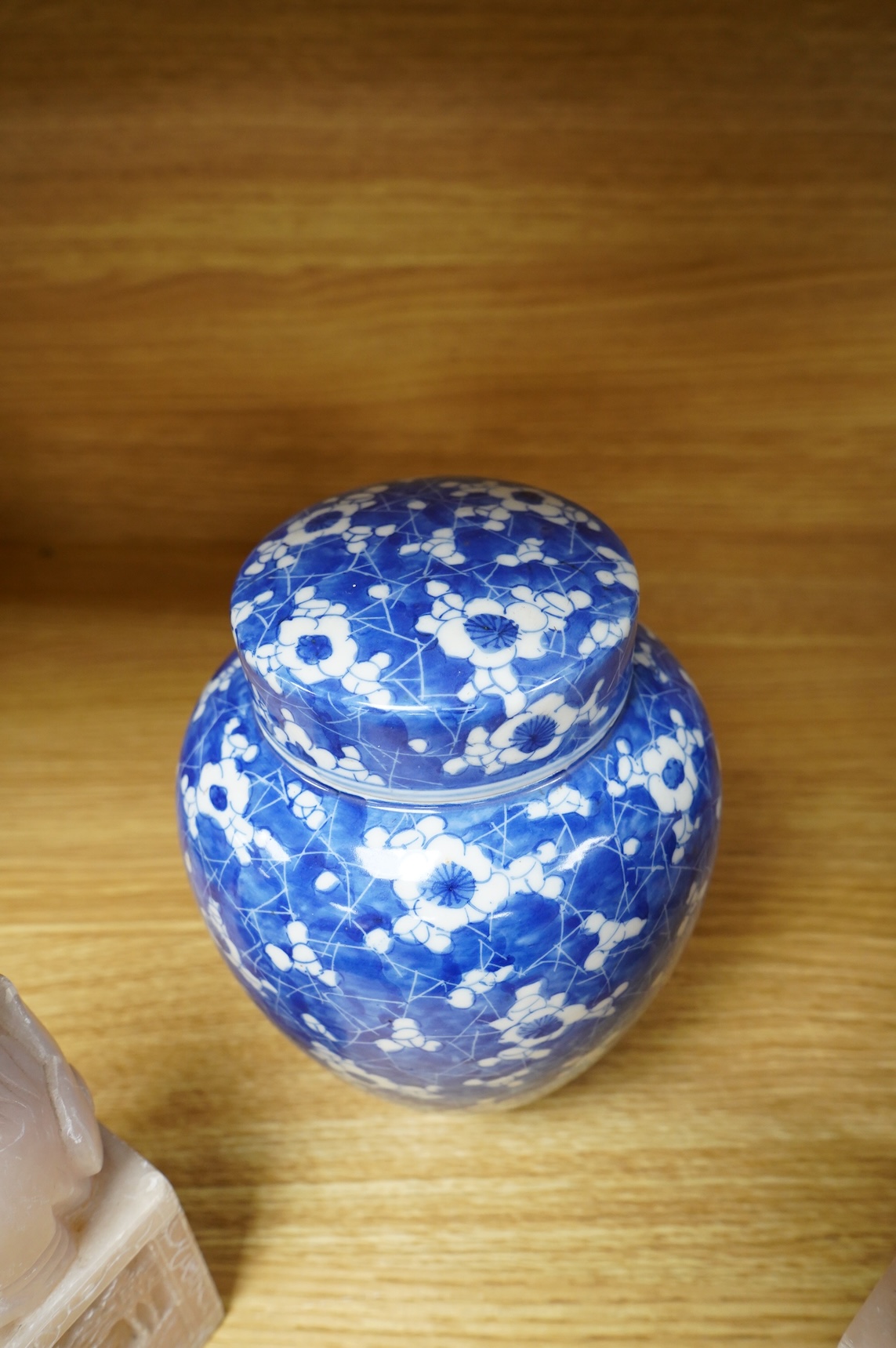 A pair of Chinese soapstone lion-dogs - 22.5cm high, two cloisonné enamel boxes and covers and a blue & white jar & cover